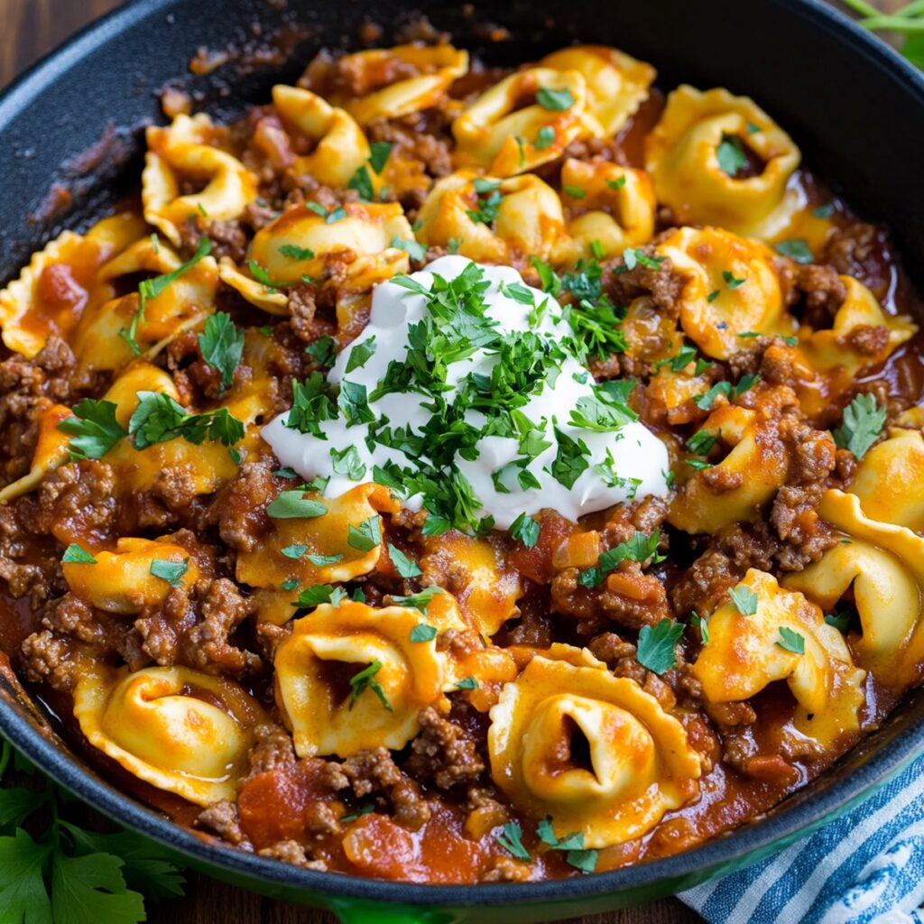 Preparing Cheesy Beef Enchilada Tortellini Skillet